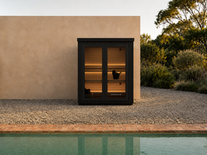 Nordhaus outdoor traditional sauna next to pool, matte black sauna 