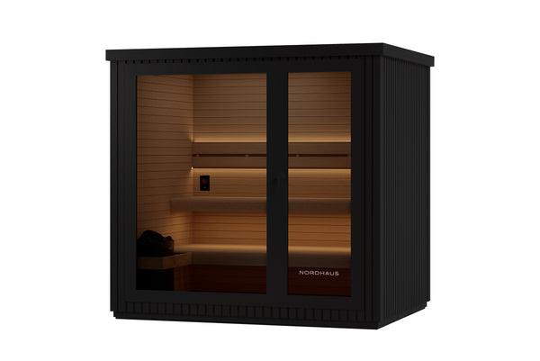 Nordhaus outdoor sauna cabinet in black with warm LED lighting inside, shown on a solid white background.