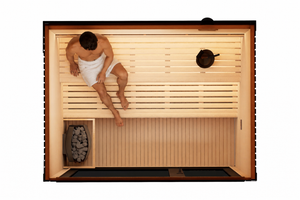 Top-down view of a 4–5 person outdoor traditional sauna with dual-level timber bench seating, Harvia-style heater with sauna stones, natural Canadian Hemlock interior, and a man relaxing inside wrapped in a white towel. Modern rectangular sauna layout with spacious floor area and premium minimalist design.