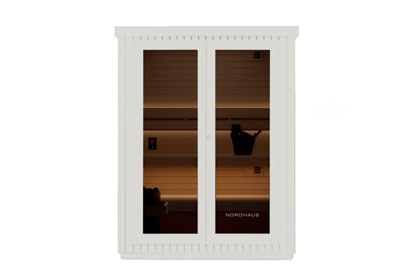White cabinet with glass doors displaying a sunset silhouette scene, featuring the brand 'Nordhaus'.