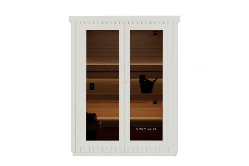 White cabinet with glass doors displaying a sunset silhouette scene, featuring the brand 'Nordhaus'.