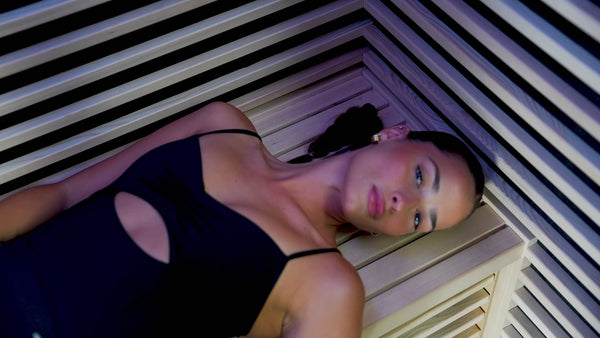 Woman relaxing inside Nordhaus sauna, premium home wellness and recovery experience